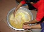 Hand mixing seasoned rice to make zong zi